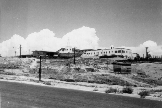 1957: Mary Magdalene Catholic Church from Galveston Street